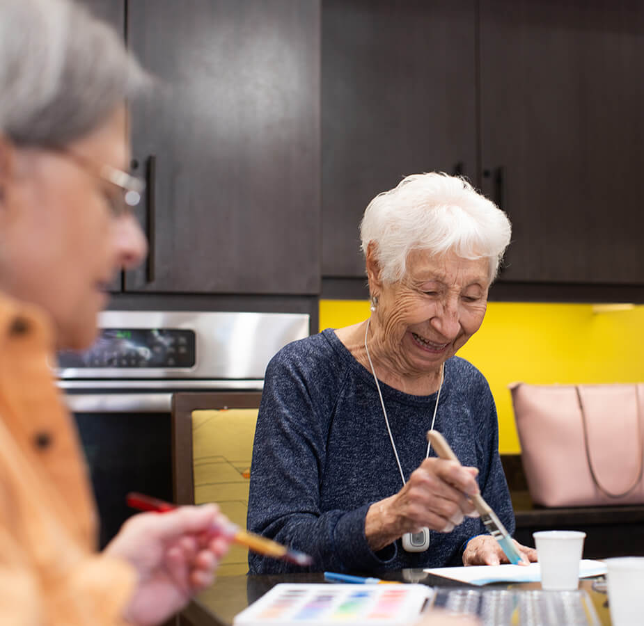 Residents enjoying an art class.
