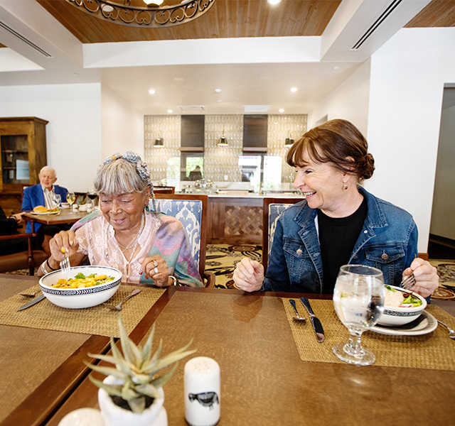 two people sitting and eating