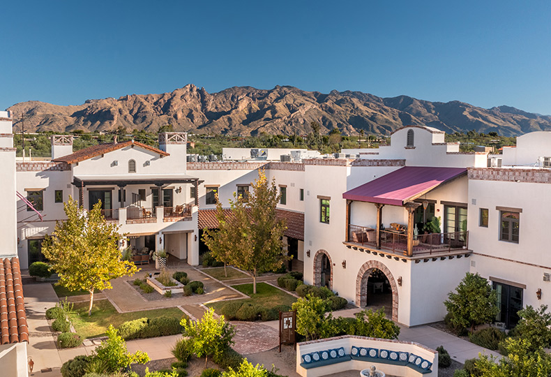 The Hacienda at the River exterior building and courtyard. 