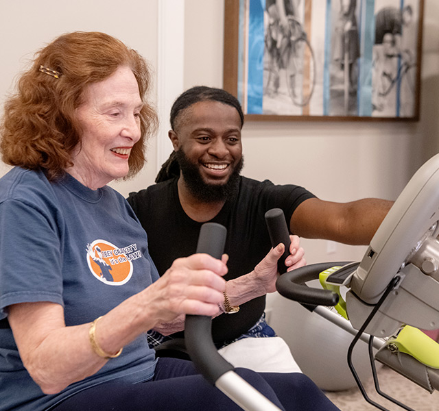 Resdient working out with a trainer.