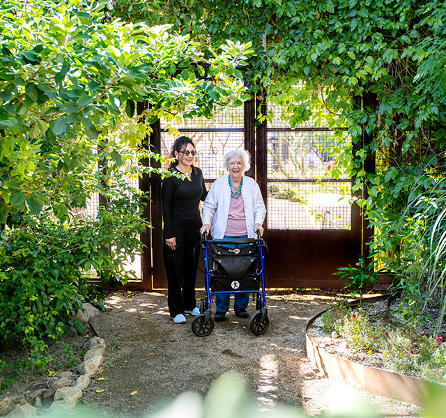 A resident with their caregiver.
