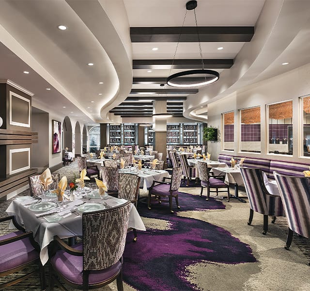 A dining room with tables set for service.