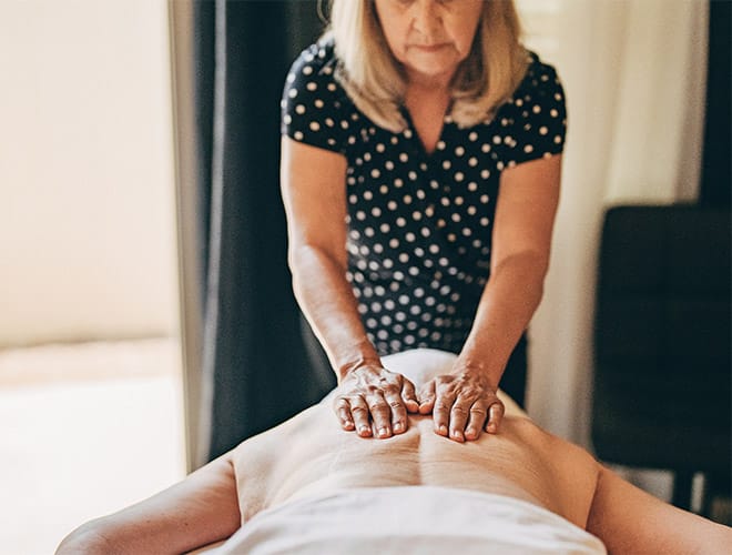 resident is having a massage at the spa