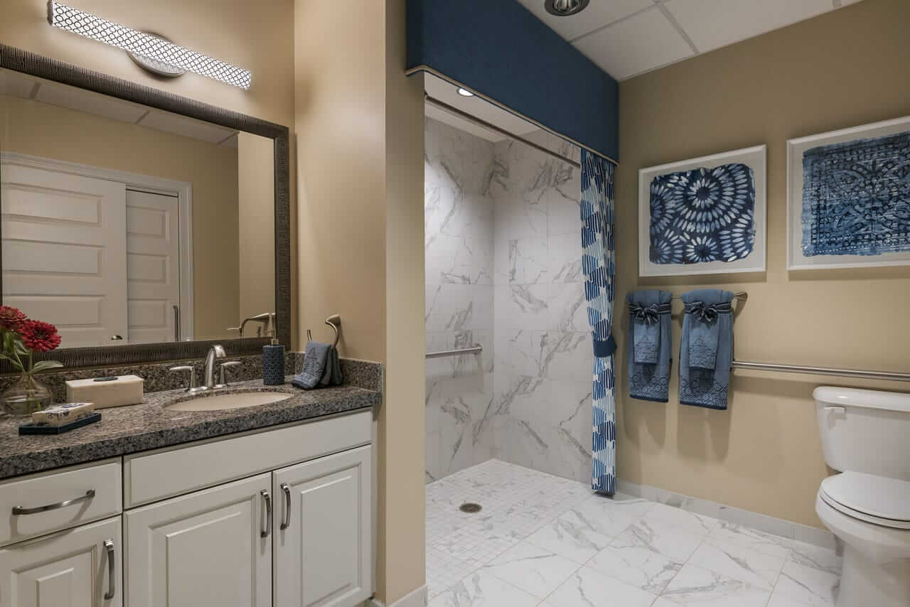 The Preston of The Park Cities bathroom with marble flooring and marble shower
