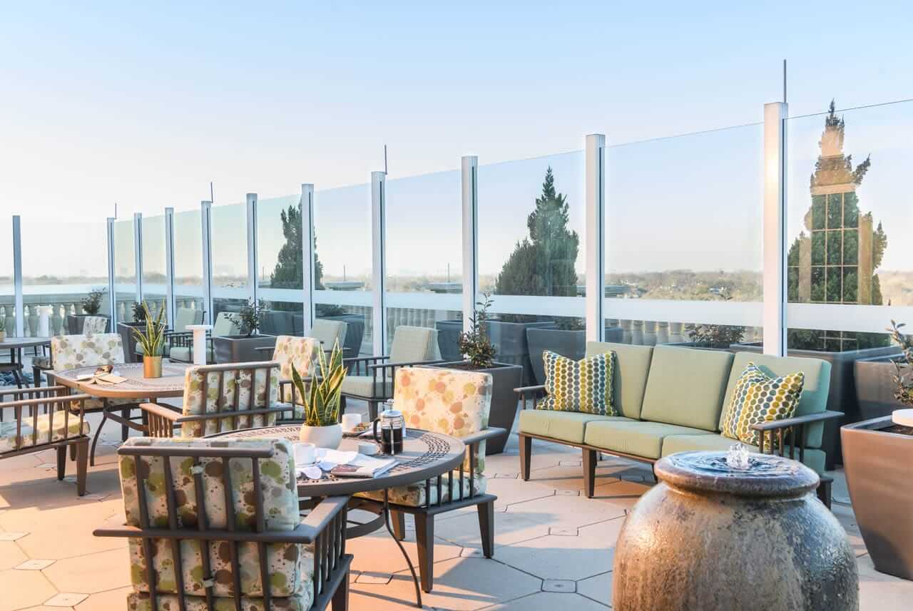 outside patio area with seating, tables and view