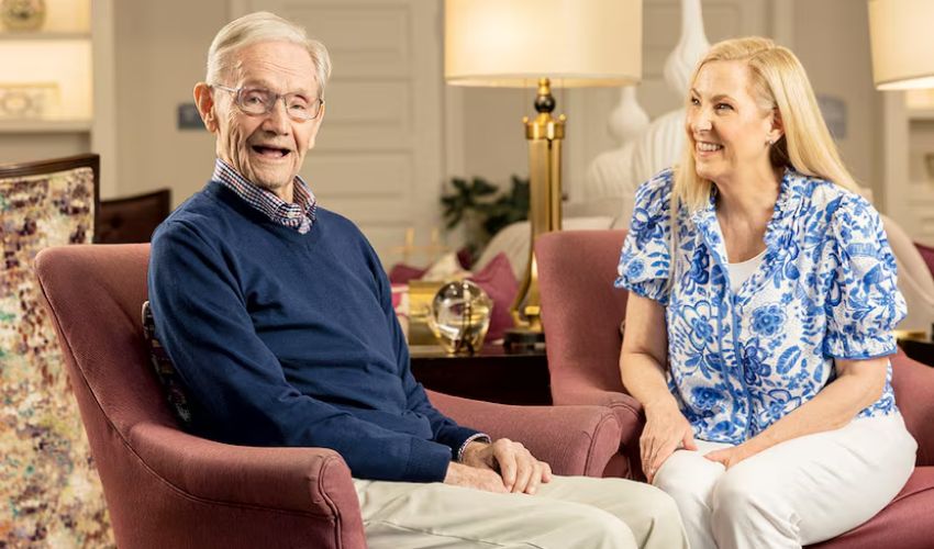A resident sitting with their daughter.