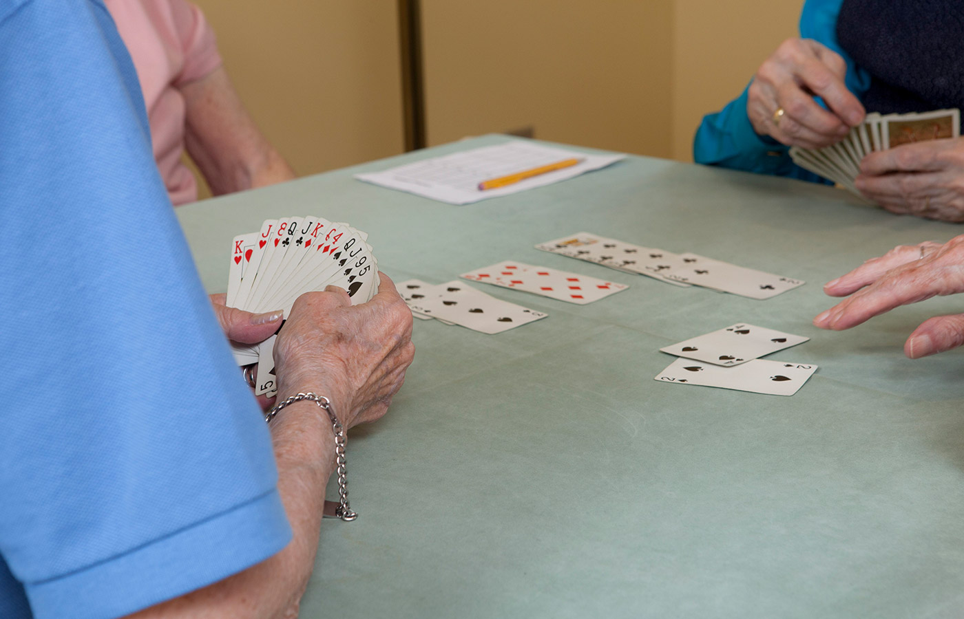 close up of residents playing cards