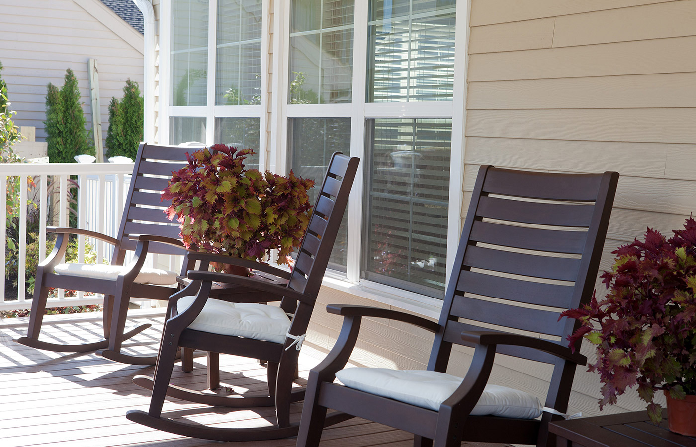 close up of rocking chairs on porch