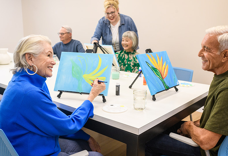 People painting in a class.