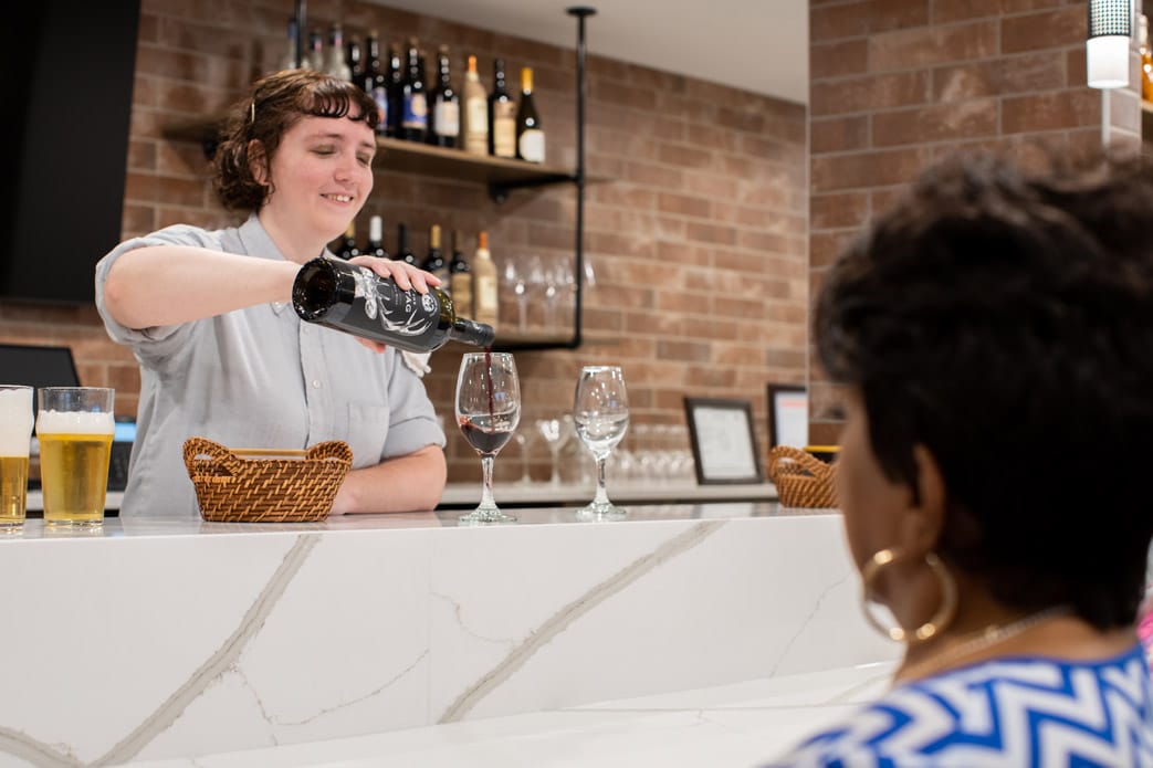 Residents are having drinks at the bar.