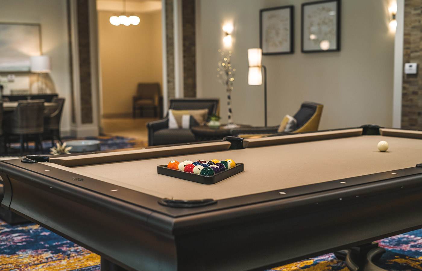 Furnished room with pool table.
