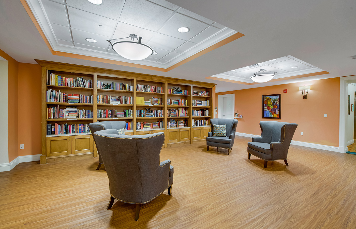 Library filled with books and seating area.
