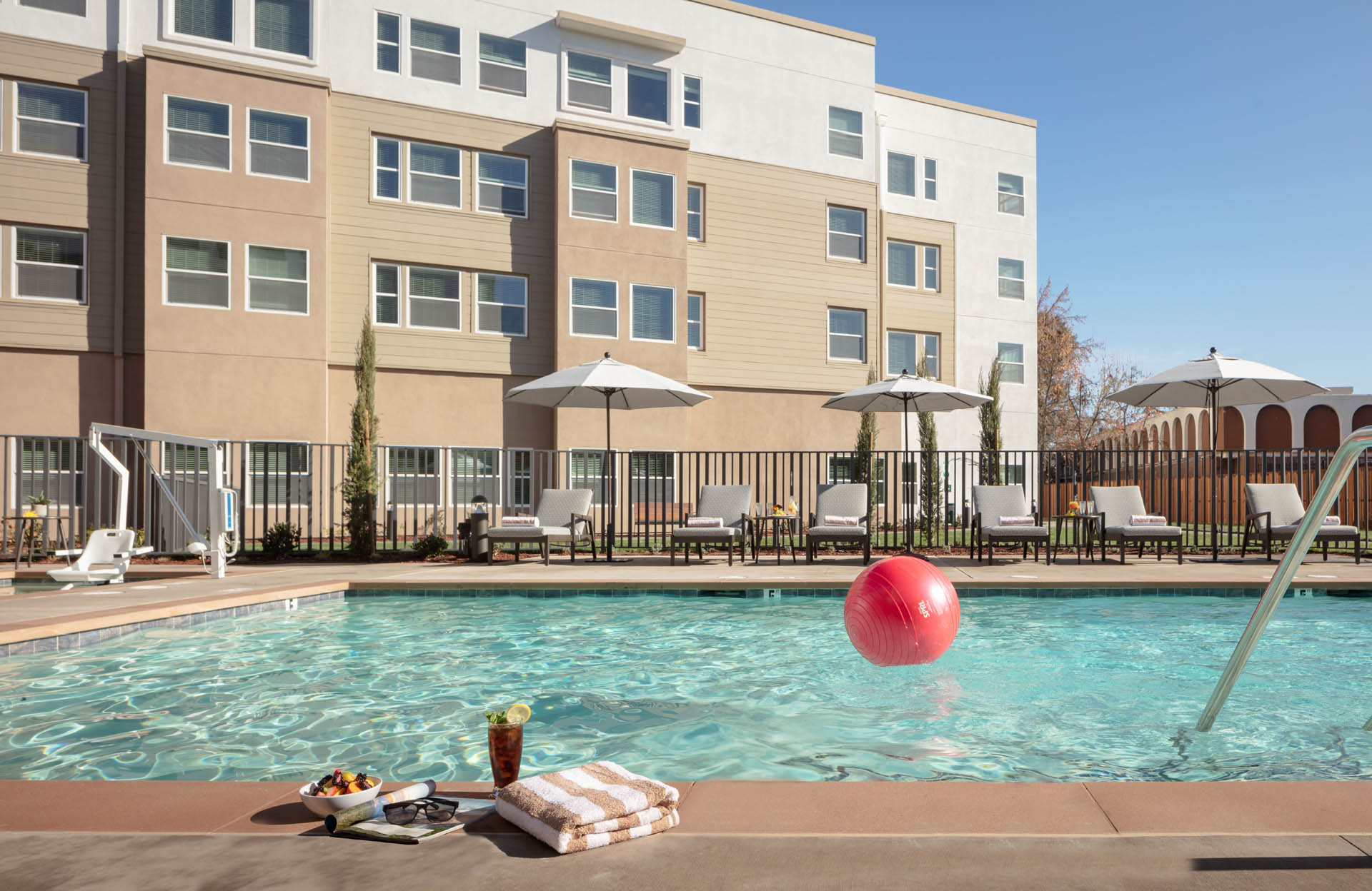 Fruit bowl and drink by the pool.