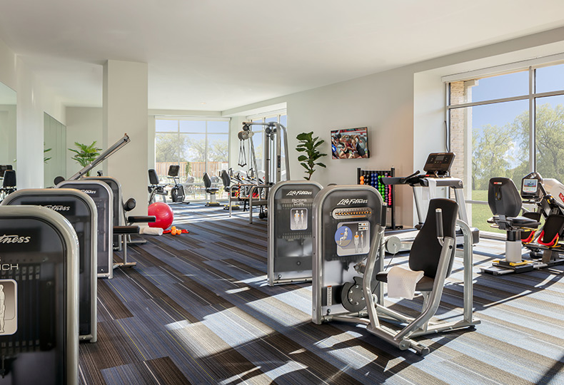 The fitness center with exercise equipment.