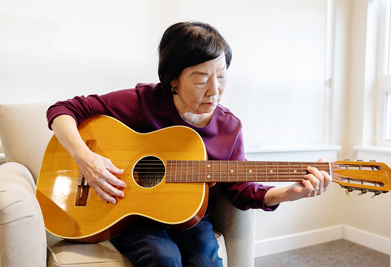 A person playing guitar.