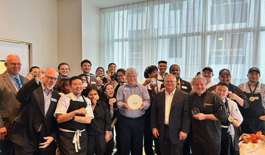 The staff at The Watermark at Bellevue with their ICAA 2025 Gold Plate of Distinction award.