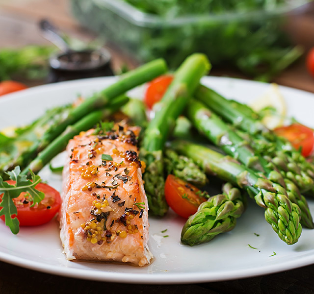 Salmon with asparagus on a plate.