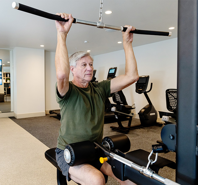 A person lifting weights at the gym.