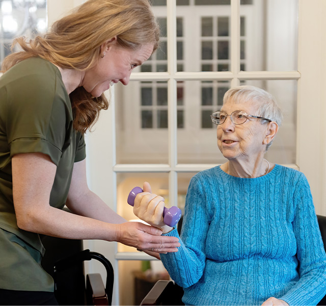 A person working with a physical therapist.