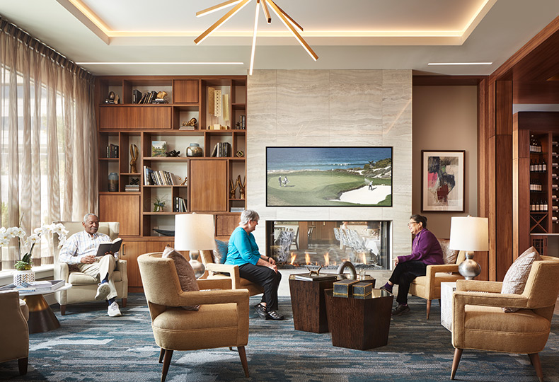 People sitting in a living room area.