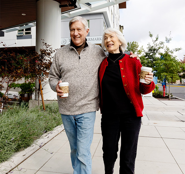 Two people walking outside.