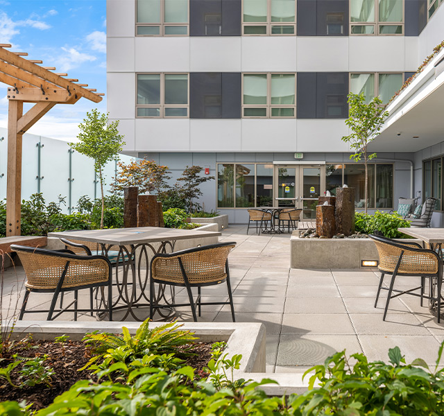 A rooftop courtyard with seating.