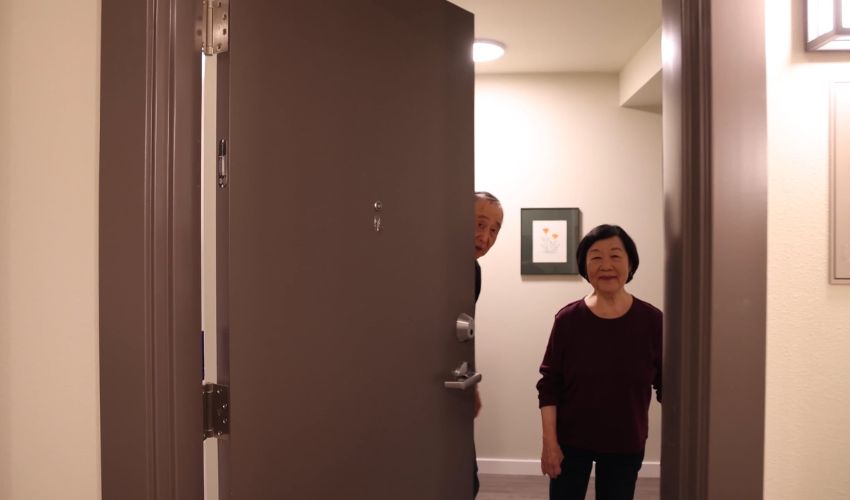 Two people opening their door.