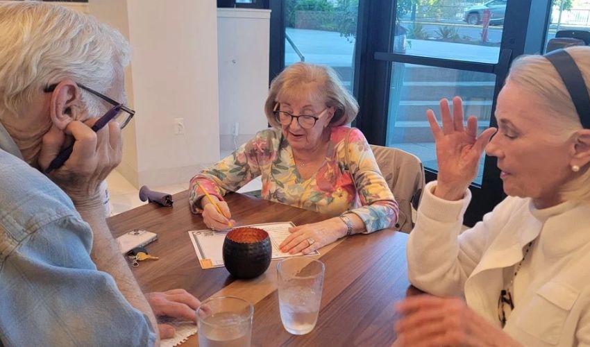 Three residents are playing a game.