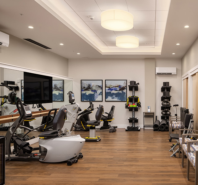 A fitness center with exercise equipment.
