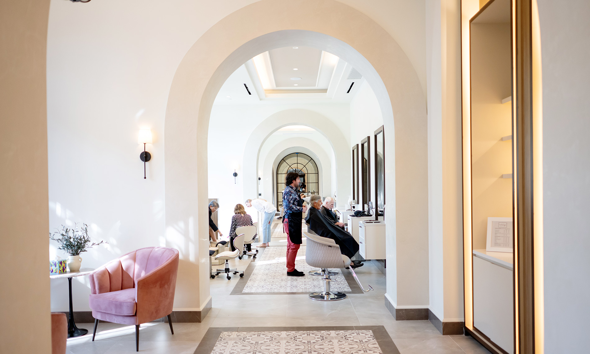 The salon with people getting their hair styled.