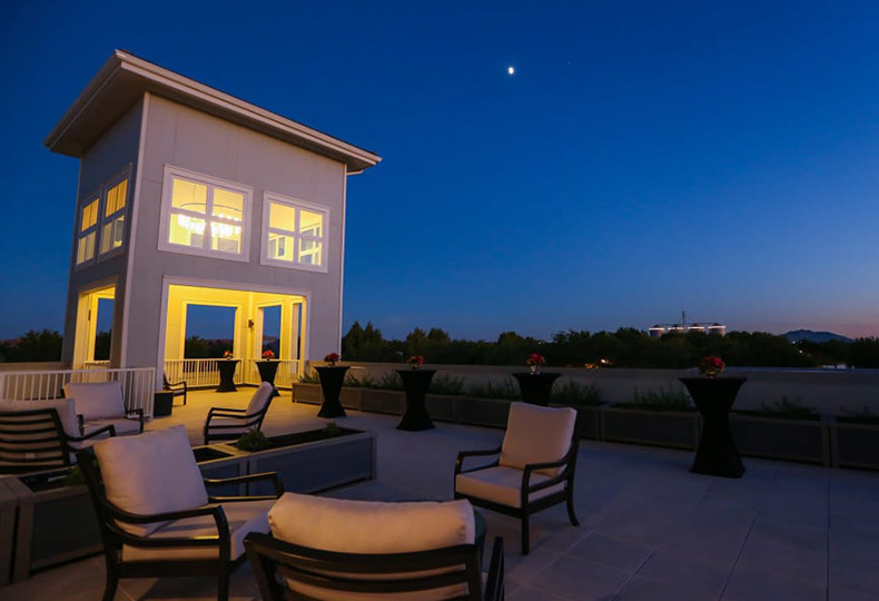 Patio seating area at night.