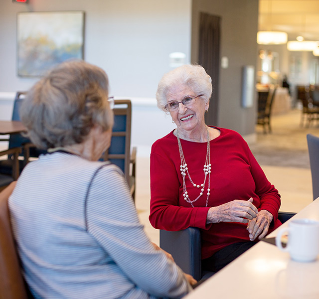 Residents  chatting over coffee.