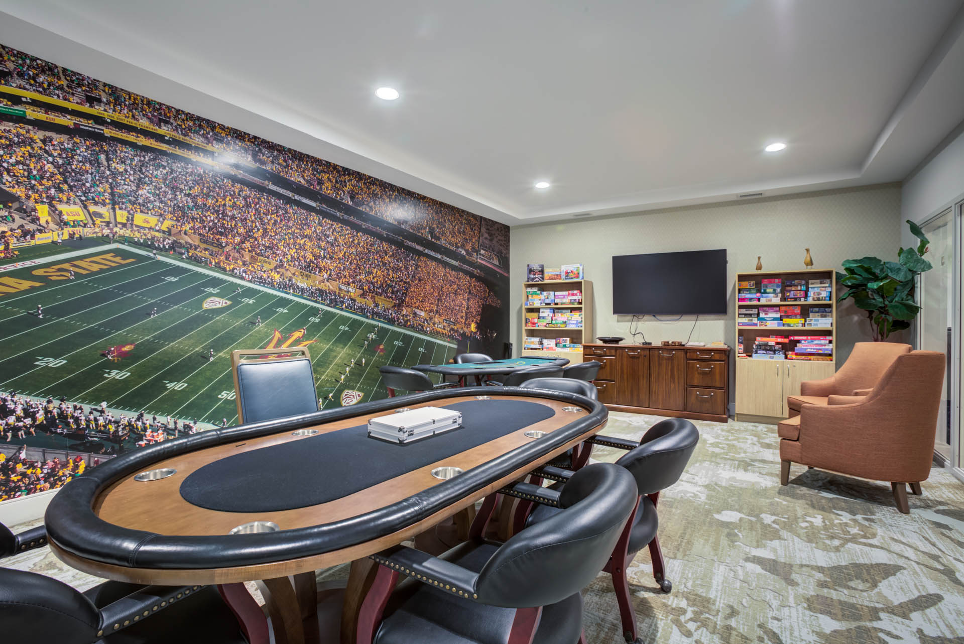 Game room with poker table and seating area.