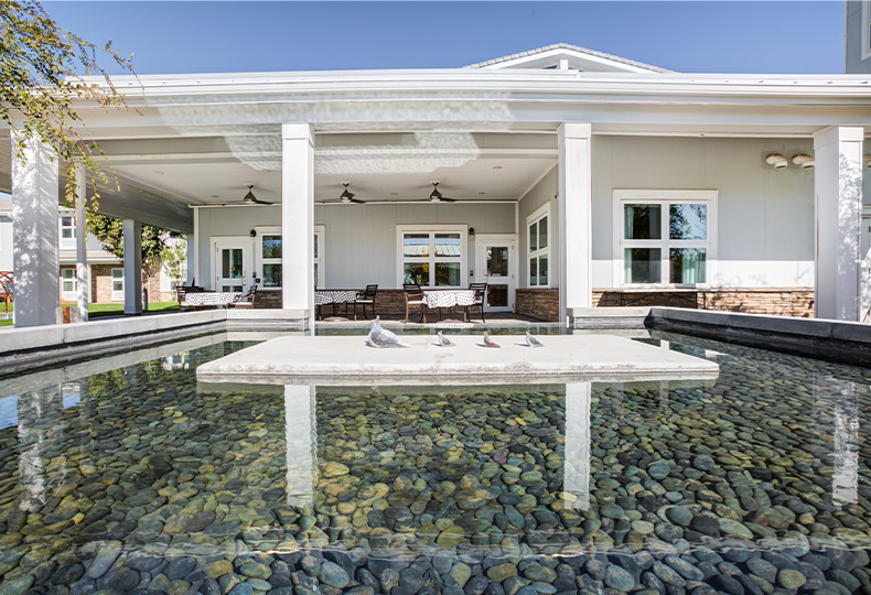 A building with a pond.