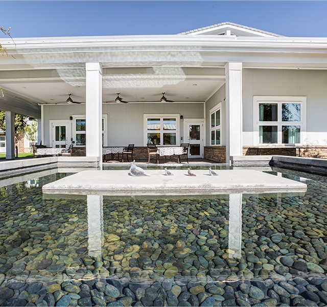 A building with a pond.