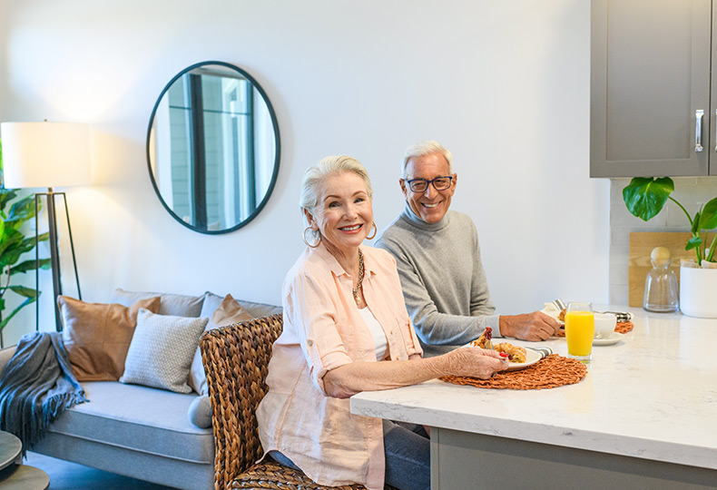 Residents having their meals in their apartment at The Watermark at Napa Valley.