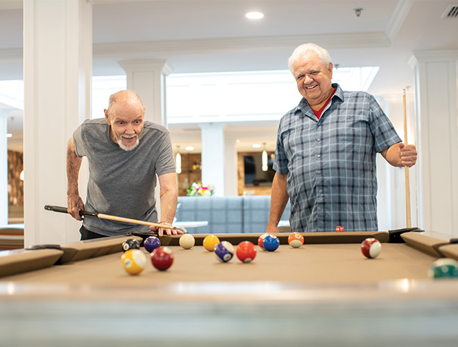 Two people playing pool together.