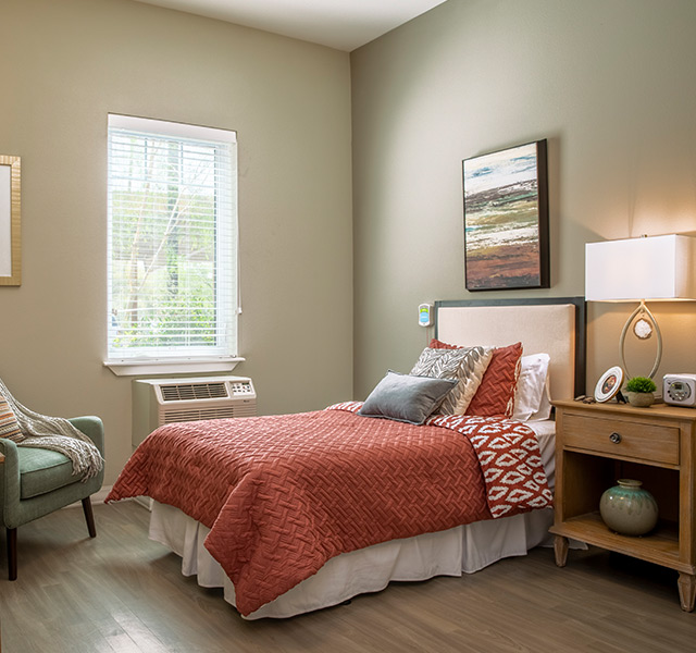 bedroom with one bed and bright window