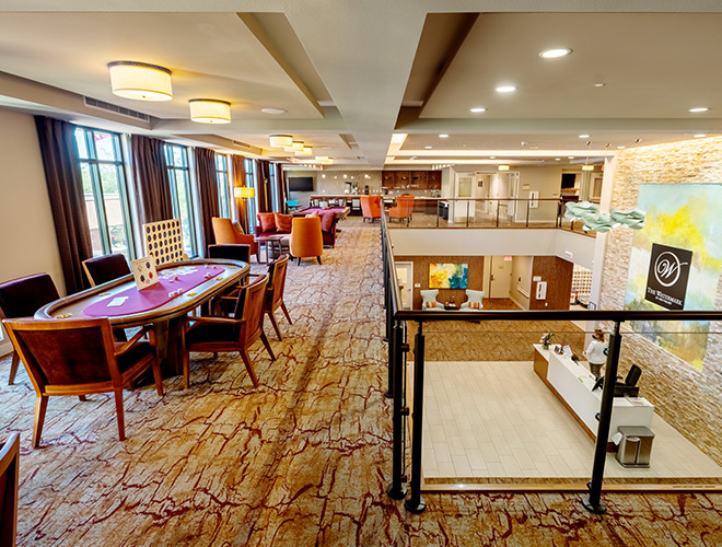 poker table on floor above lobby area