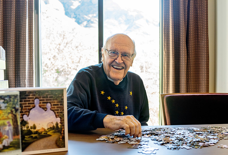 A resident is putting together a puzzle.