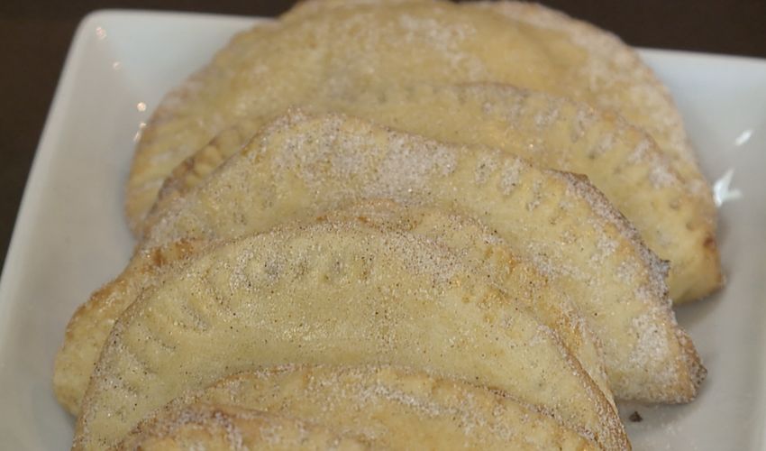 A plate of dessert empanadas.