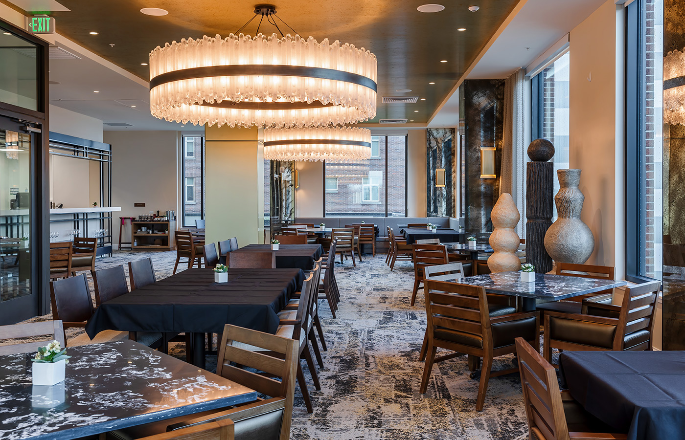 A dining room with modern lighting.