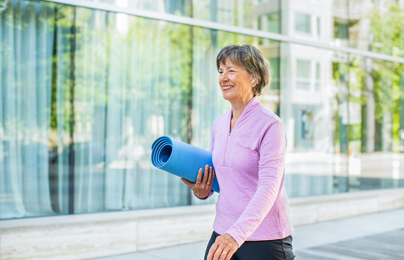 A person walking to yoga.