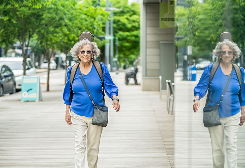 A person walking on the sidewalk.