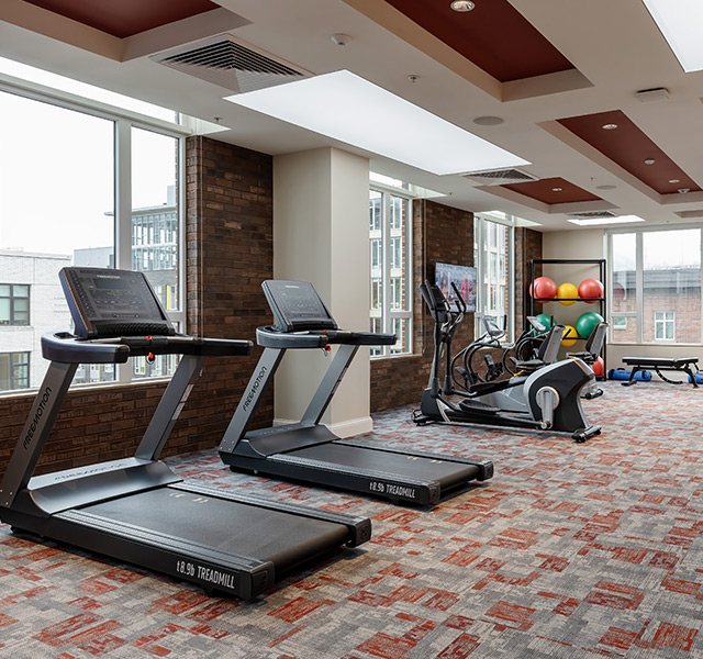A fitness center with treadmills.