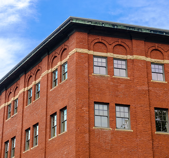 A warehouse against a blue sky.