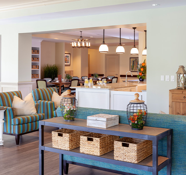 I living room with a couch and baskets on a shelf.