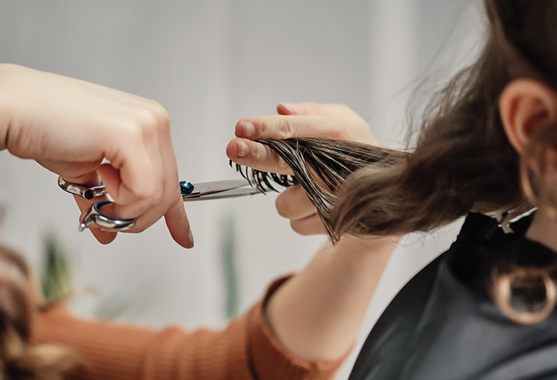 A resident is having their haircut.