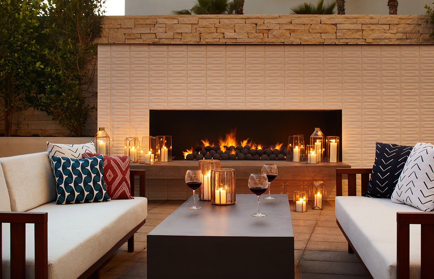 close up of large outdoor fire place and seating