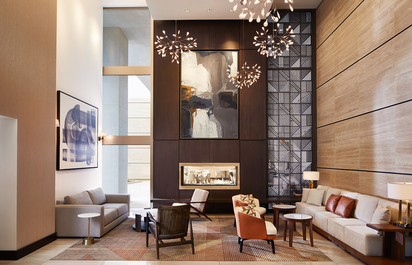 stylish decorated lobby area with a seating area and modern fire place